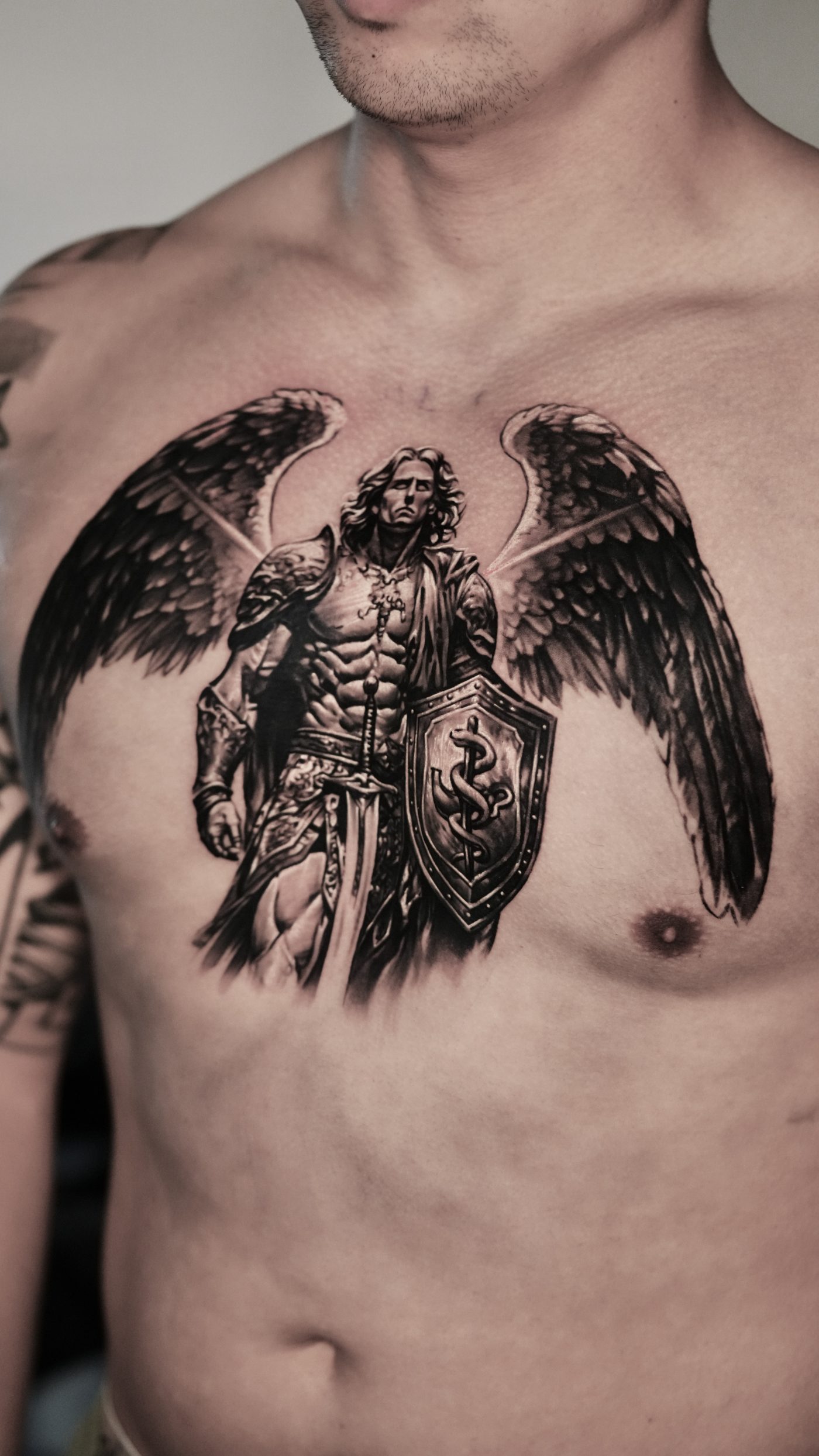 Hyperrealism portrait tattoo on chest by Ramon Rodrigo